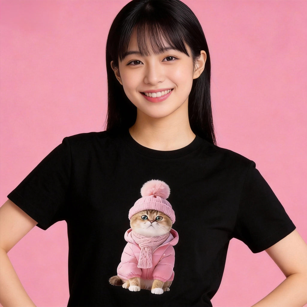 Woman wearing Sunny Brand pink winter cat t-shirt, cozy outfit with sweet pink cat graphic black color